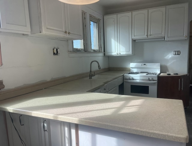 3742 W Grand St, Detroit, MI 48238 - kitchen with white gas range oven, white cabinets, and light countertops