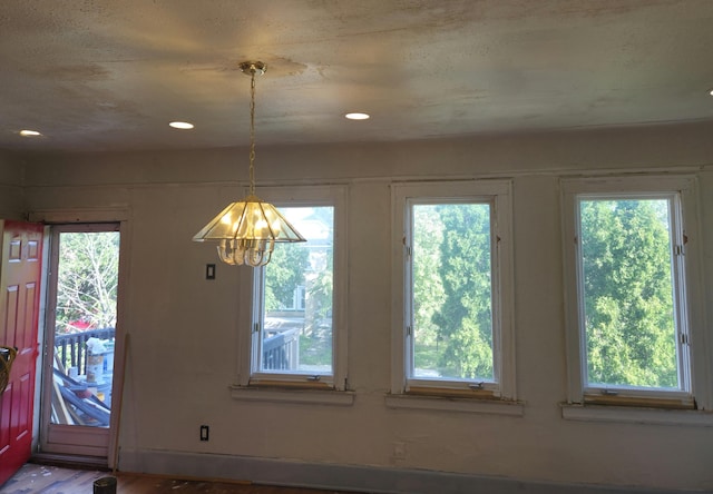 3742 W Grand St, Detroit, MI 48238 - unfurnished dining area with a chandelier, recessed lighting, and wood finished floors