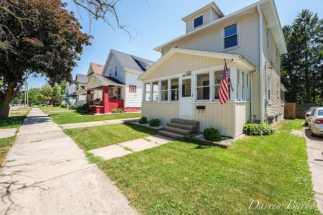 1118 Sibley St NW, Grand Rapids, MI 49504 - traditional style home featuring entry steps and board and batten siding