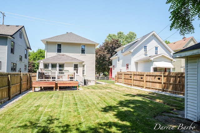 1118 Sibley St NW, Grand Rapids, MI 49504 - back of house featuring a fenced backyard and a wooden deck