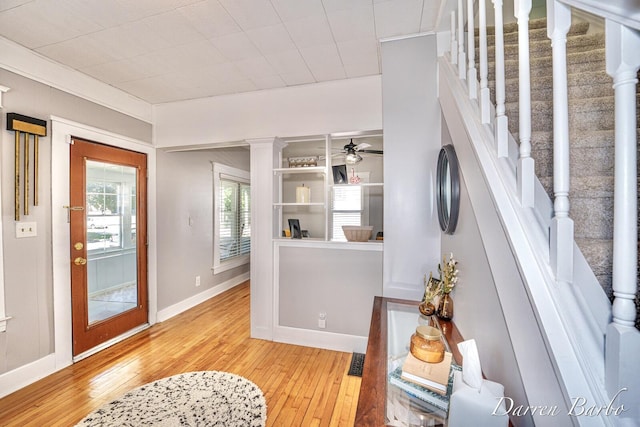 1118 Sibley St NW, Grand Rapids, MI 49504 - foyer entrance with light wood-style floors, stairs, and ceiling fan