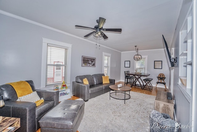 1118 Sibley St NW, Grand Rapids, MI 49504 - living area with wood finished floors, crown molding, and a ceiling fan