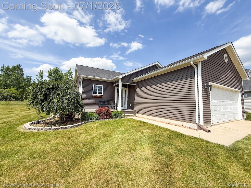 9391 Sunrise Ln, Davison, MI 48423 - view of front of home with an attached garage, a front yard, and concrete driveway