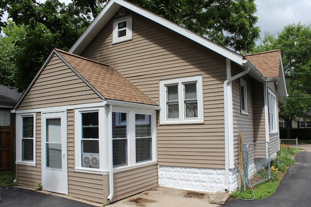 3316 Adams St, Kalamazoo, MI 49008 - view of side of property with a shingled roof