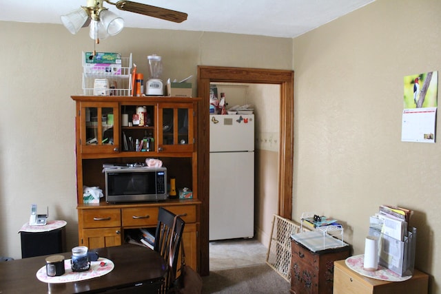 3316 Adams St, Kalamazoo, MI 49008 - dining room featuring ceiling fan and light carpet
