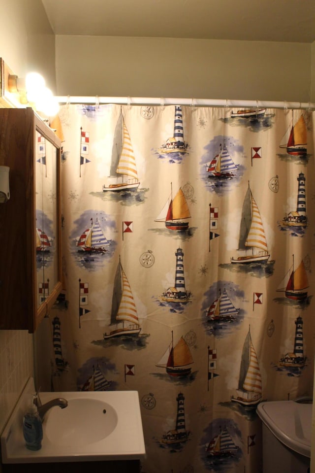 3316 Adams St, Kalamazoo, MI 49008 - bathroom with vanity and a shower with shower curtain