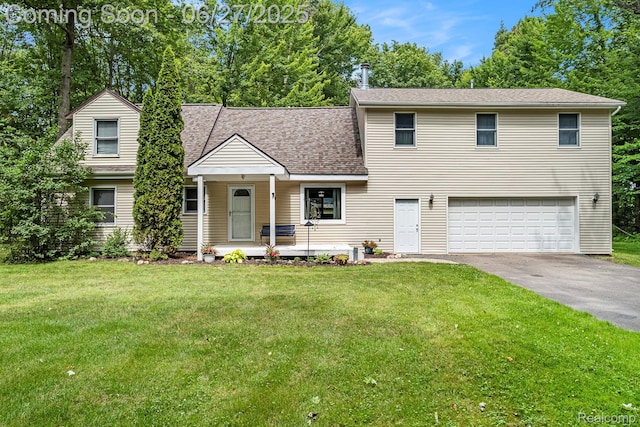 15375 Murray Rd, Byron, MI 48418 - view of front facade with a garage, covered porch, asphalt driveway, and a front yard