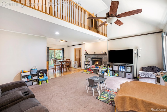 15375 Murray Rd, Byron, MI 48418 - carpeted living area featuring ceiling fan, high vaulted ceiling, and a tiled fireplace
