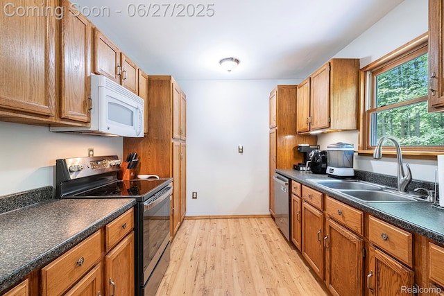 15375 Murray Rd, Byron, MI 48418 - kitchen featuring electric range, white microwave, light wood-type flooring, dark countertops, and stainless steel dishwasher