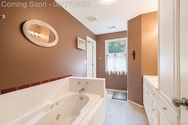 15375 Murray Rd, Byron, MI 48418 - bathroom featuring vanity, a jetted tub, and tile patterned flooring