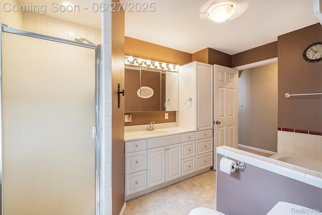 15375 Murray Rd, Byron, MI 48418 - bathroom featuring a shower stall, vanity, a garden tub, and tile patterned flooring