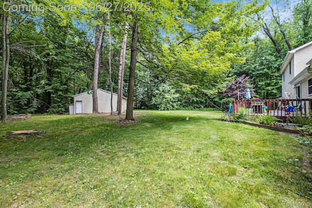 15375 Murray Rd, Byron, MI 48418 - view of grassy yard featuring a storage shed