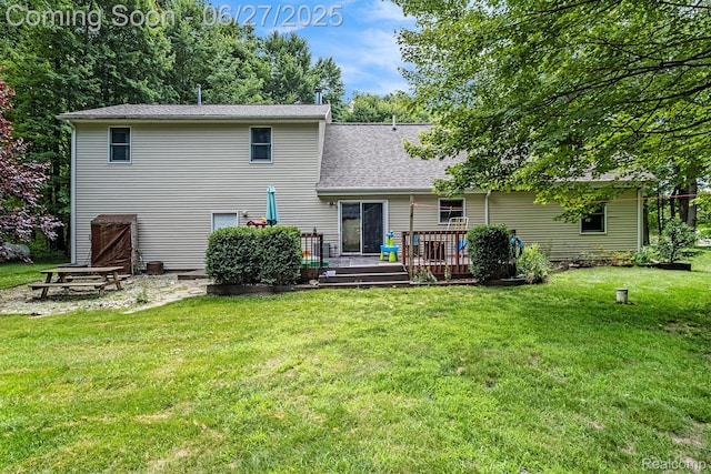 15375 Murray Rd, Byron, MI 48418 - back of house featuring a deck, a yard, and a shingled roof