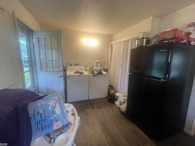 1297 W Kurtz Ave, Flint, MI 48505 - laundry room with washing machine and clothes dryer, dark wood-type flooring, and a textured ceiling