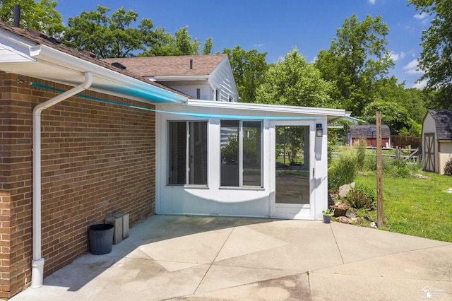 7558 Indian Rd, Temperance, MI 48182 - back of house with a patio area and brick siding