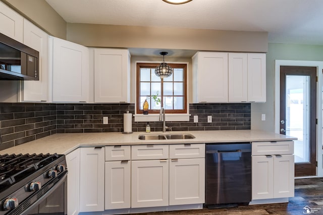 7558 Indian Rd, Temperance, MI 48182 - kitchen with dishwashing machine, stainless steel microwave, dark wood-type flooring, and white cabinetry