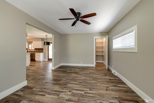 7558 Indian Rd, Temperance, MI 48182 - unfurnished room with a ceiling fan and dark wood-style flooring