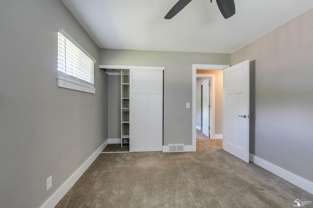 7558 Indian Rd, Temperance, MI 48182 - unfurnished bedroom featuring a closet, carpet, and a ceiling fan