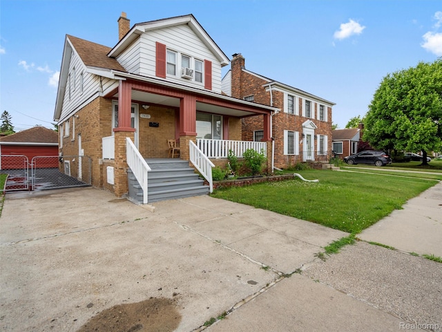 7420 Coolidge, Center Line, MI 48015 - view of front facade featuring brick siding, a porch, a front yard, a gate, and a chimney