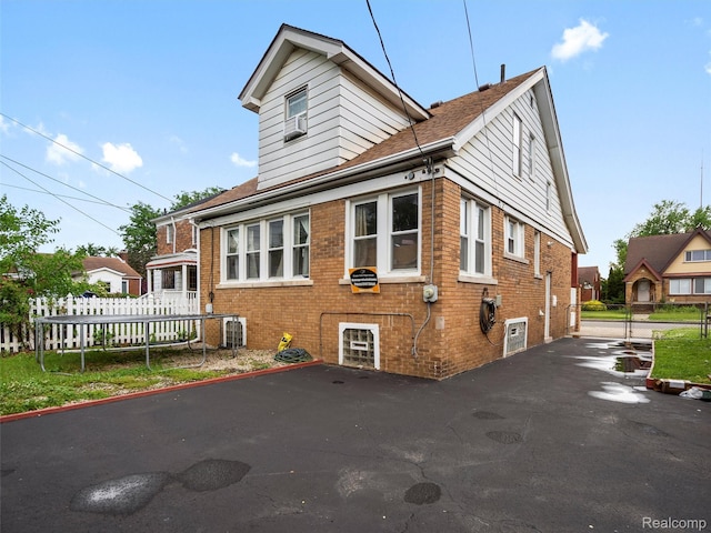 7420 Coolidge, Center Line, MI 48015 - view of front of house with brick siding and roof with shingles