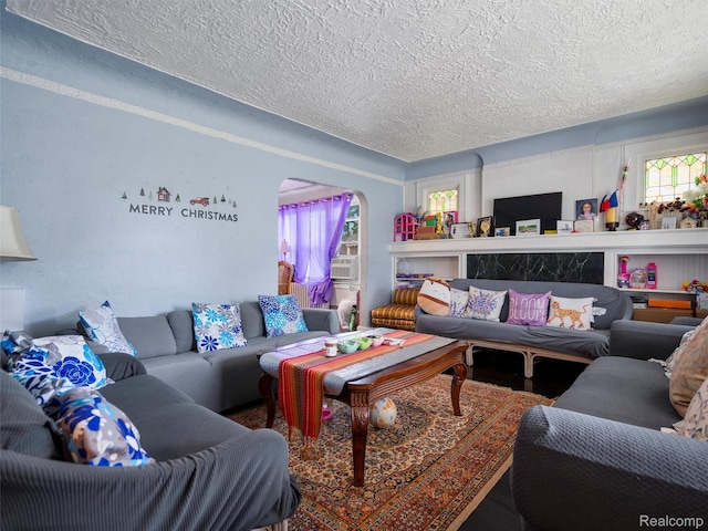 7420 Coolidge, Center Line, MI 48015 - living area with a textured ceiling, arched walkways, and cooling unit