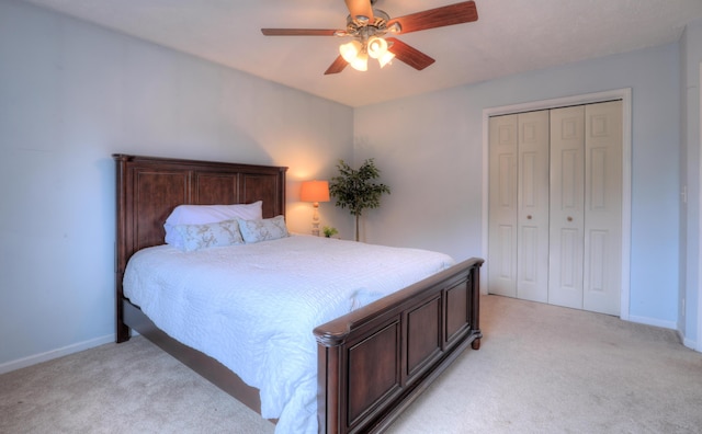 10895 Riley St, Zeeland, MI 49464 - bedroom featuring light carpet, a closet, and ceiling fan