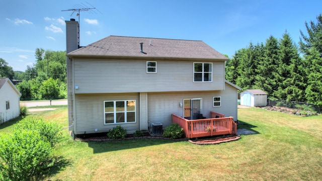 10895 Riley St, Zeeland, MI 49464 - rear view of property featuring a storage shed, a chimney, and a wooden deck