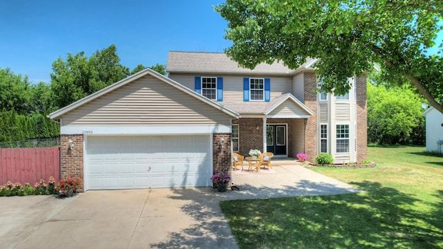 10895 Riley St, Zeeland, MI 49464 - traditional-style house with brick siding, concrete driveway, and a garage