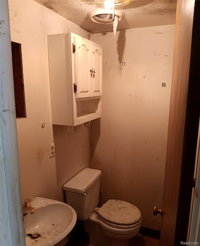 3375 Jacque St, Flint, MI 48532 - half bathroom with a sink and toilet