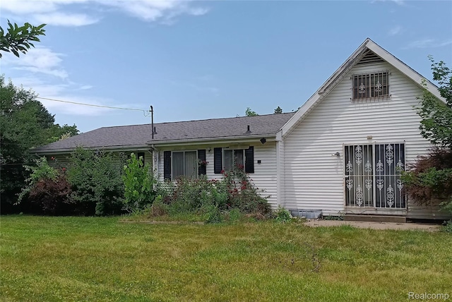 3375 Jacque St, Flint, MI 48532 - rear view of property with a lawn
