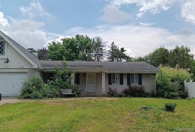 3375 Jacque St, Flint, MI 48532 - single story home featuring a front yard, brick siding, and an attached garage