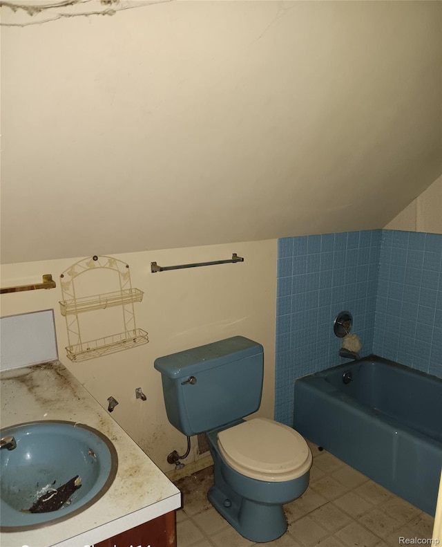 3375 Jacque St, Flint, MI 48532 - full bathroom featuring a bath, lofted ceiling, and vanity