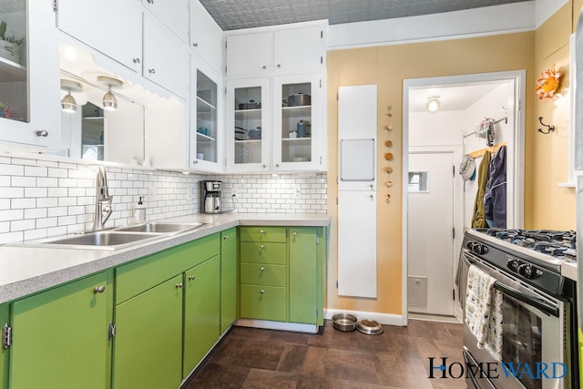 660 Deming St SE, Grand Rapids, MI 49507 - kitchen with stainless steel range with gas cooktop, light countertops, and backsplash
