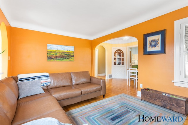 660 Deming St SE, Grand Rapids, MI 49507 - living area featuring arched walkways and wood finished floors