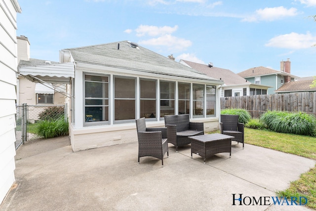 660 Deming St SE, Grand Rapids, MI 49507 - view of patio / terrace with a sunroom and a gate