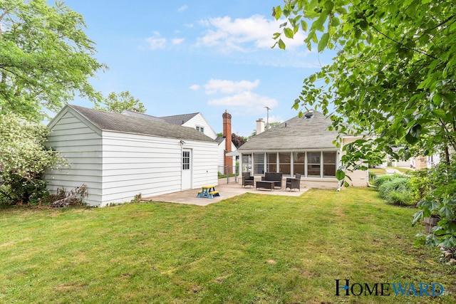 660 Deming St SE, Grand Rapids, MI 49507 - rear view of property with a sunroom, a patio area, a lawn, and an outdoor living space