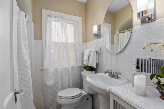 2013 Duiker Ave NE, Grand Rapids, MI 49505 - bathroom with tile walls and a wainscoted wall