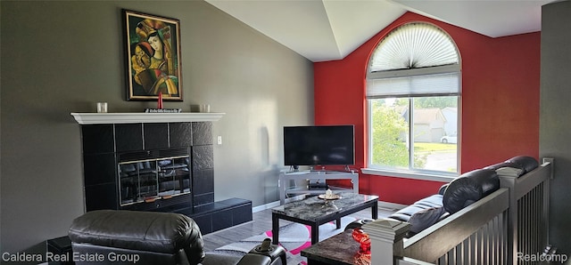 38478 Draper Ln, Westland, MI 48186 - living area with a tile fireplace, lofted ceiling, and wood finished floors
