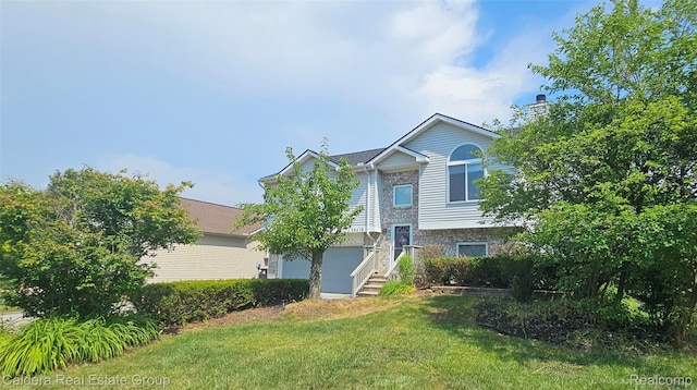 38478 Draper Ln, Westland, MI 48186 - split foyer home featuring a front yard and a garage