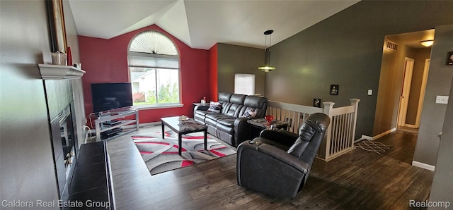 38478 Draper Ln, Westland, MI 48186 - living room with lofted ceiling, wood finished floors, and a fireplace