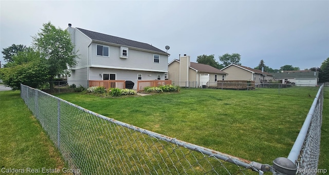 38478 Draper Ln, Westland, MI 48186 - back of house with a fenced backyard, a deck, and a chimney