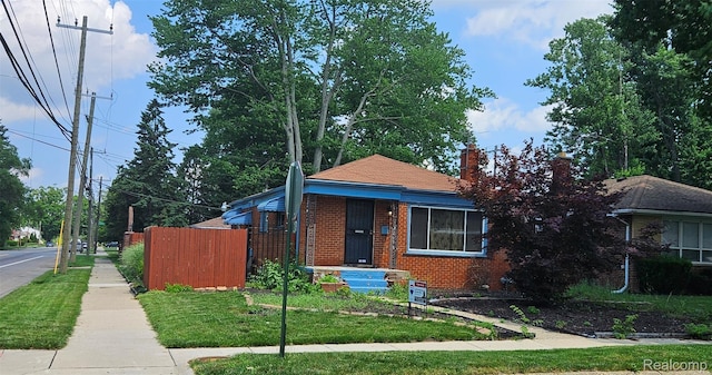 22638 Chippewa St, Detroit, MI 48219 - bungalow-style house featuring brick siding and a chimney