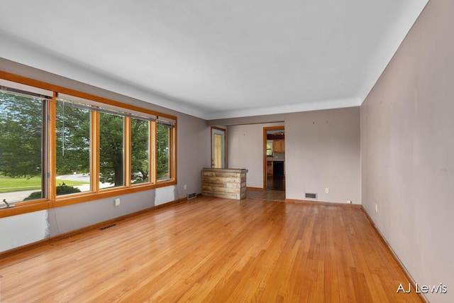 2155 Lake Michigan Dr NW, Grand Rapids, MI 49504 - empty room with wood finished floors and baseboards
