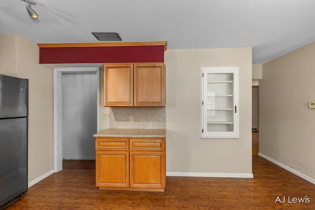 2155 Lake Michigan Dr NW, Grand Rapids, MI 49504 - kitchen with freestanding refrigerator, dark wood-style floors, decorative backsplash, and light countertops
