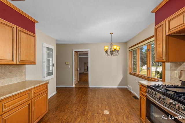 2155 Lake Michigan Dr NW, Grand Rapids, MI 49504 - kitchen with stainless steel gas range oven, backsplash, a chandelier, and dark wood-type flooring