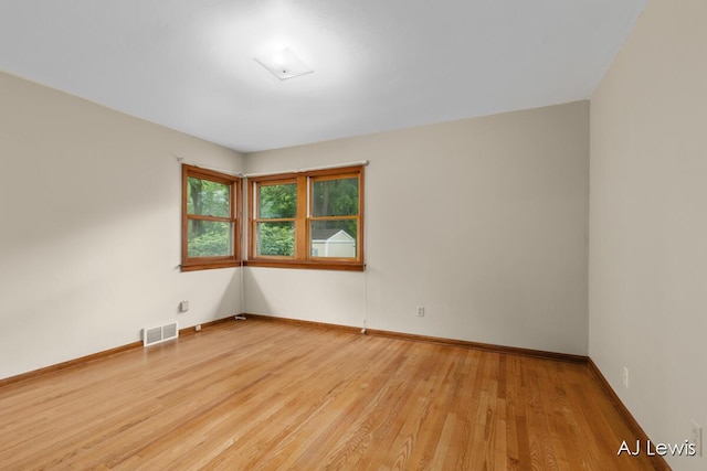 2155 Lake Michigan Dr NW, Grand Rapids, MI 49504 - spare room featuring light wood-type flooring and baseboards