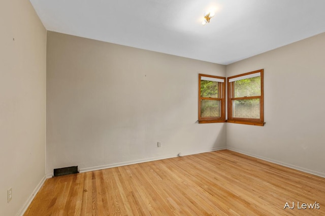 2155 Lake Michigan Dr NW, Grand Rapids, MI 49504 - spare room featuring wood finished floors and baseboards