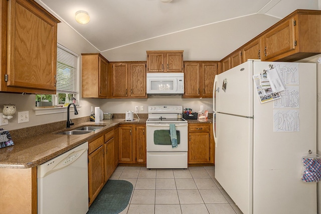 46317 Dequindre Rd, Rochester Hills, MI 48307 - kitchen featuring white appliances, lofted ceiling, brown cabinets, light tile patterned floors, and dark stone counters