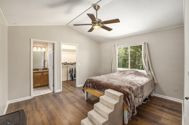 46317 Dequindre Rd, Rochester Hills, MI 48307 - bedroom with wood finished floors, a spacious closet, vaulted ceiling, ensuite bathroom, and a ceiling fan