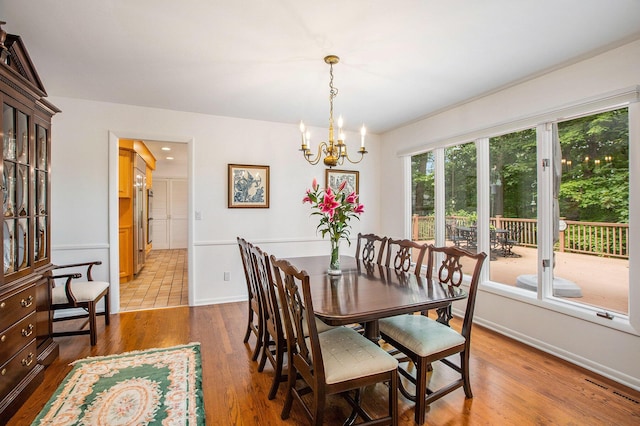 3924 Penberton Dr, Ann Arbor, MI 48105 - dining area with a chandelier and wood finished floors